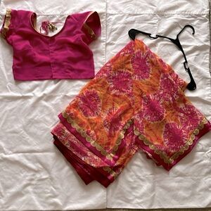 Orange and pink saree. Formal Indian/Pakistan wear.